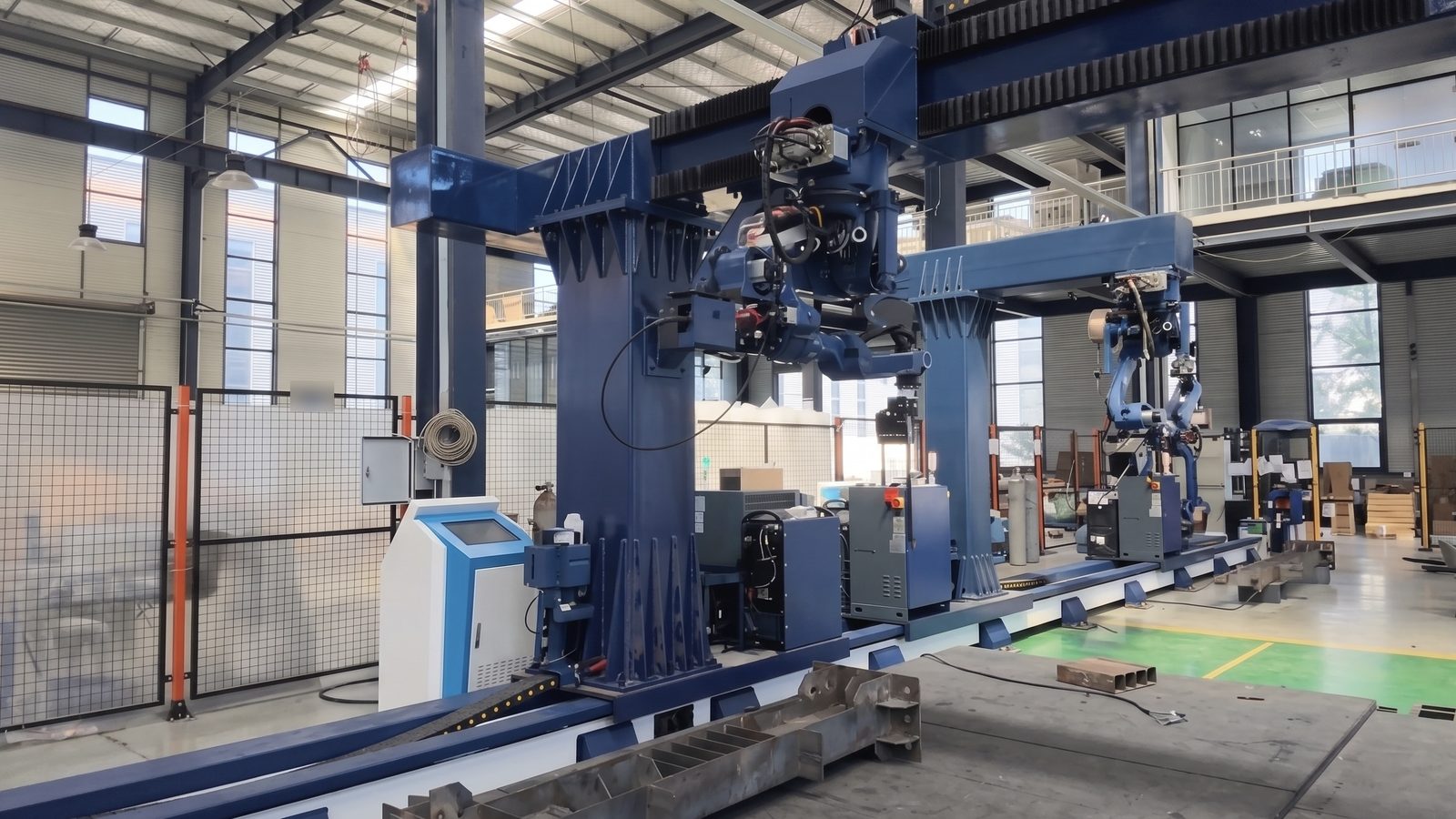 Two Weldrix robotic welding units traveling on the servo-driven ground rail